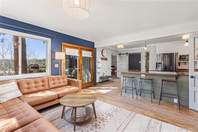 377 Homestead Rd, Bailey, CO 80421 - living area featuring a barn door and light wood-type flooring