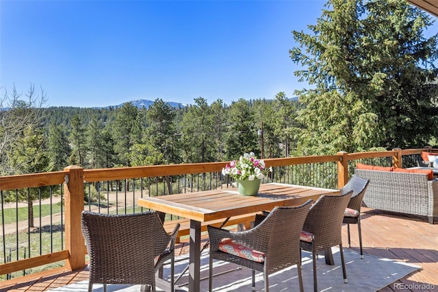 377 Homestead Rd, Bailey, CO 80421 - wooden terrace with a forest view and outdoor dining area