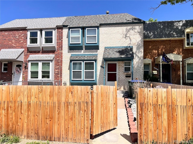 11646 Pearl St, Northglenn, CO 80233 - townhome / multi-family property with brick siding and roof with shingles