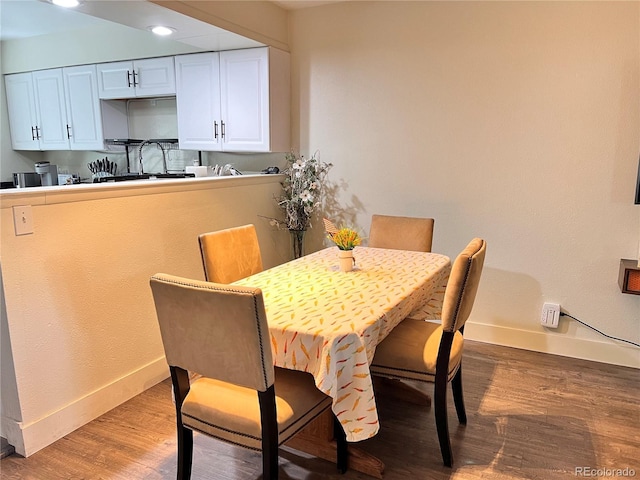 11646 Pearl St, Northglenn, CO 80233 - dining room featuring baseboards and light wood-style flooring