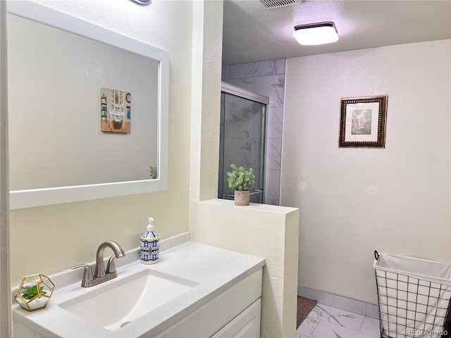 11646 Pearl St, Northglenn, CO 80233 - bathroom featuring marble finish floors, a stall shower, and vanity