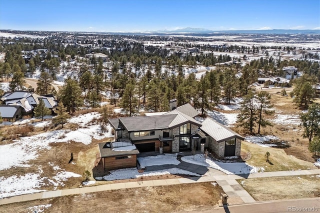 snowy aerial view featuring a mountain view