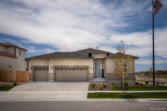 13410 New Ranch Dr, Peyton, CO 80831 - view of front of home with an attached garage, driveway, and stucco siding