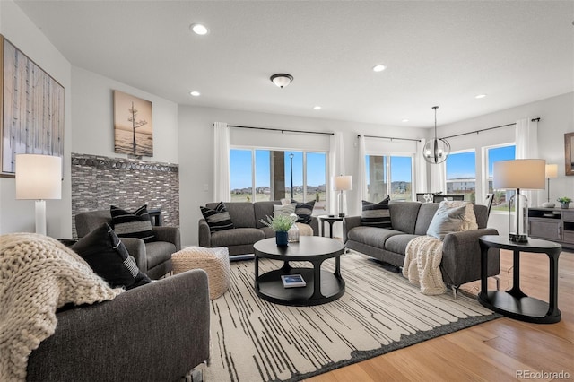 13410 New Ranch Dr, Peyton, CO 80831 - living room featuring wood finished floors, recessed lighting, and a chandelier