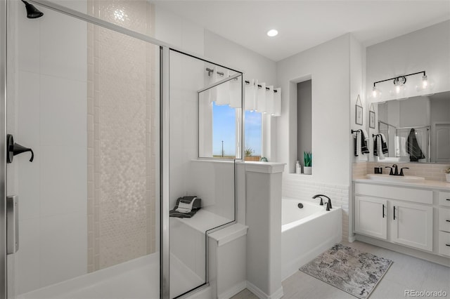 13410 New Ranch Dr, Peyton, CO 80831 - bathroom featuring vanity, a stall shower, a bath, and tile patterned floors