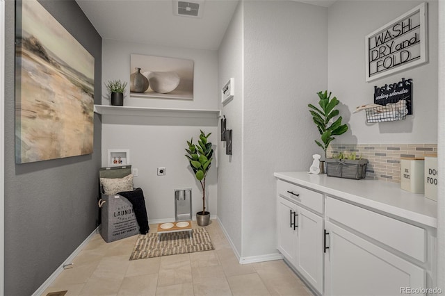 13410 New Ranch Dr, Peyton, CO 80831 - laundry room with hookup for an electric dryer, hookup for a washing machine, baseboards, and cabinet space