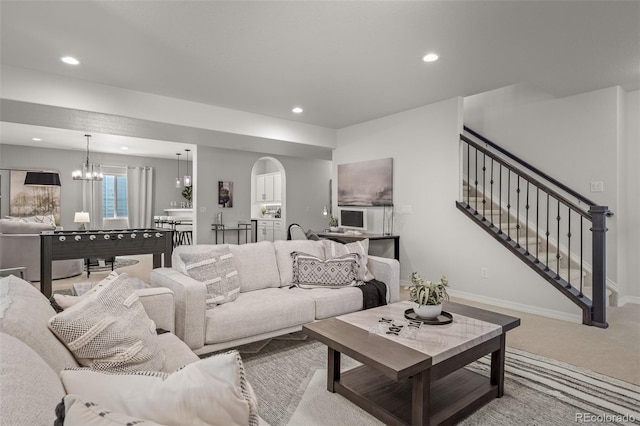 13410 New Ranch Dr, Peyton, CO 80831 - living room featuring a chandelier, carpet flooring, recessed lighting, baseboards, and stairway