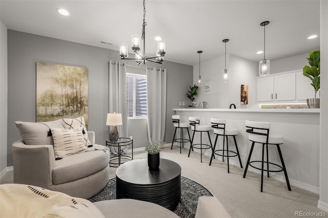 13410 New Ranch Dr, Peyton, CO 80831 - living area with light colored carpet, baseboards, a chandelier, and recessed lighting