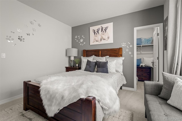 13410 New Ranch Dr, Peyton, CO 80831 - bedroom with a walk in closet, light colored carpet, a closet, and baseboards