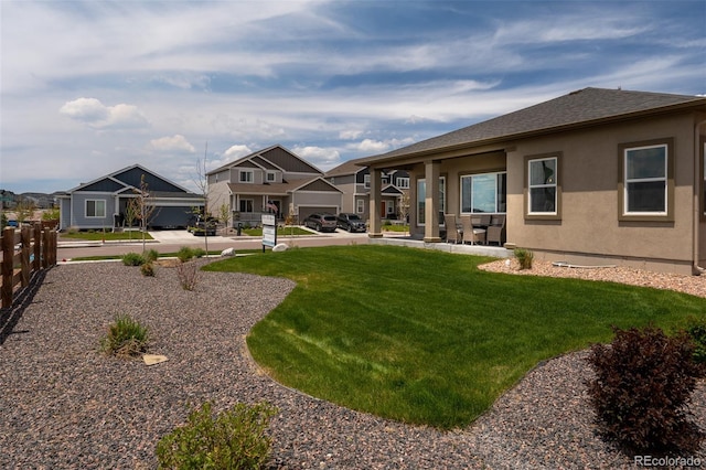 13410 New Ranch Dr, Peyton, CO 80831 - back of property featuring stucco siding, a residential view, a shingled roof, and a patio