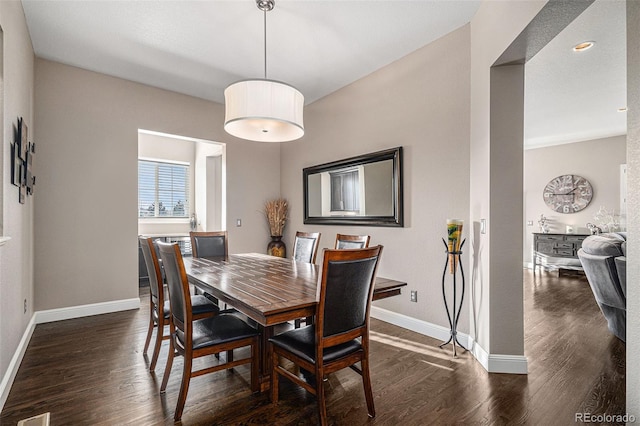 dining area featuring dark hardwood / wood-style flooring