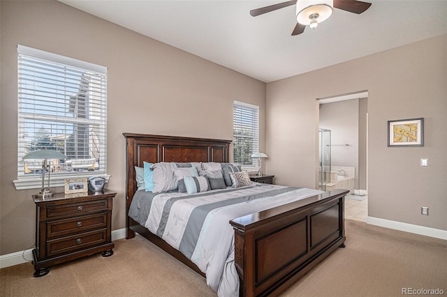 bedroom with light carpet, connected bathroom, and ceiling fan