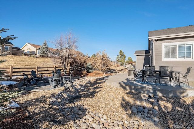 view of yard with a patio area and an outdoor fire pit