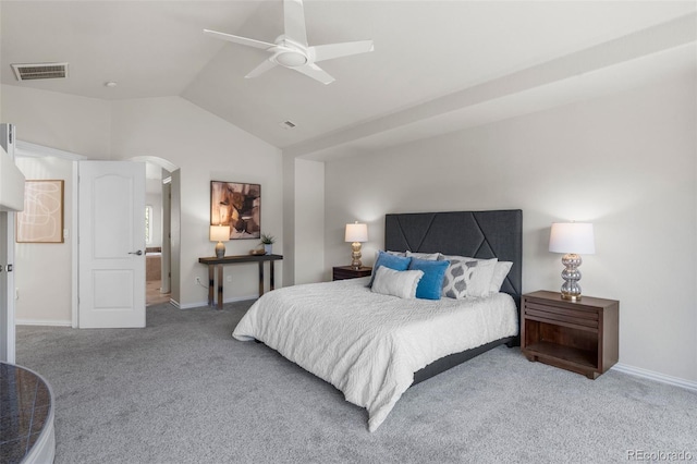 carpeted bedroom featuring visible vents, ceiling fan, baseboards, vaulted ceiling, and arched walkways