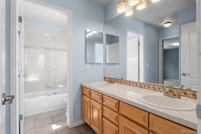 full bathroom with tile patterned flooring, double vanity, toilet, and a sink