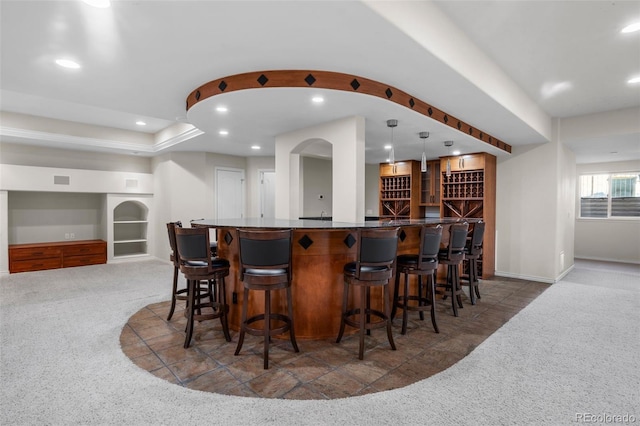 bar with built in features, recessed lighting, bar area, and carpet floors