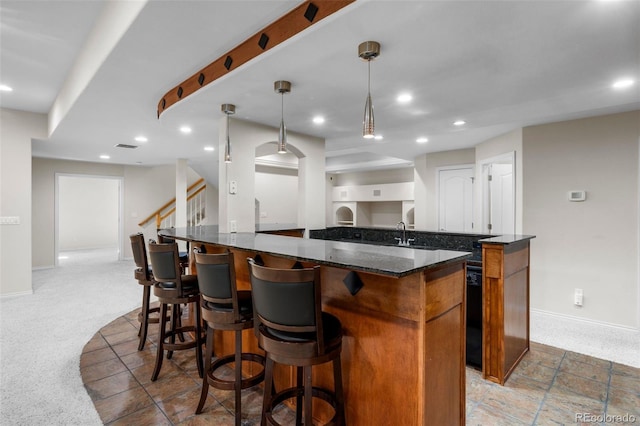 kitchen featuring open floor plan, recessed lighting, and a kitchen island