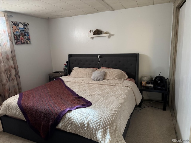 bedroom featuring light colored carpet