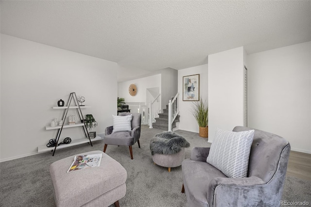 18527 E Kansas Pl, Aurora, CO 80017 - sitting room featuring stairway and a textured ceiling