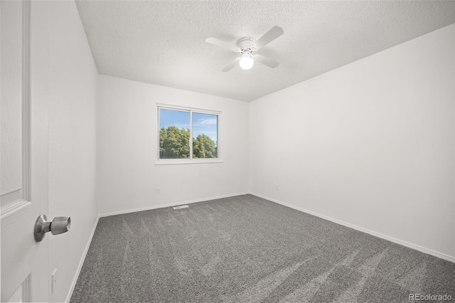 18527 E Kansas Pl, Aurora, CO 80017 - spare room featuring dark colored carpet, ceiling fan, and a textured ceiling