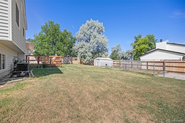 18527 E Kansas Pl, Aurora, CO 80017 - fenced backyard featuring a storage shed
