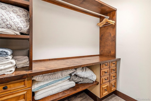 walk in closet featuring built in study area