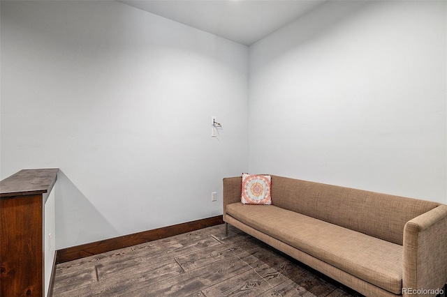 sitting room featuring baseboards and wood finished floors