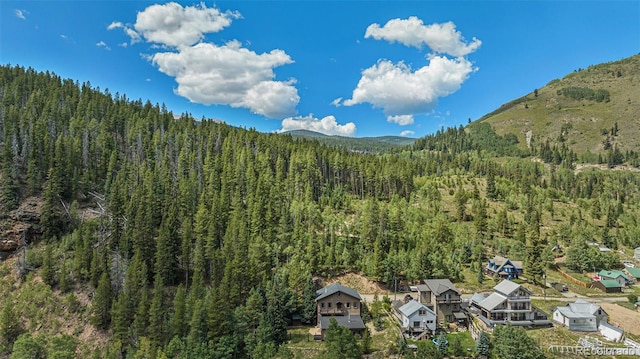 mountain view featuring a view of trees