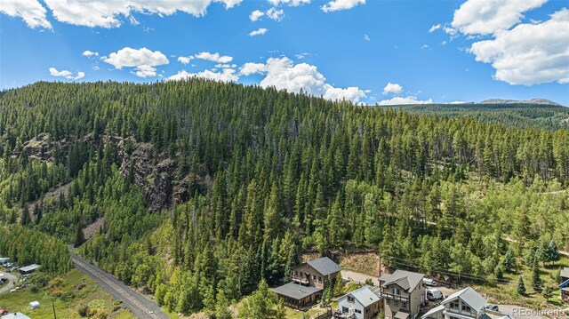 aerial view featuring a view of trees