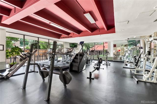 exercise room with a textured ceiling