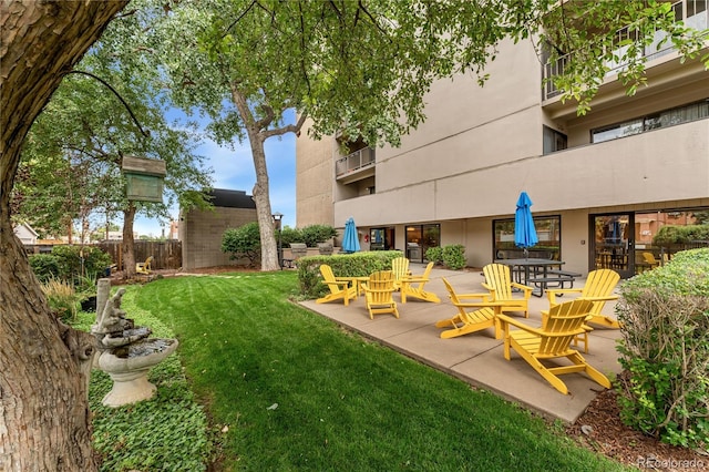 exterior space with a lawn and a patio