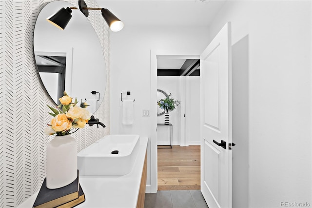 bathroom with a sink and tile patterned floors