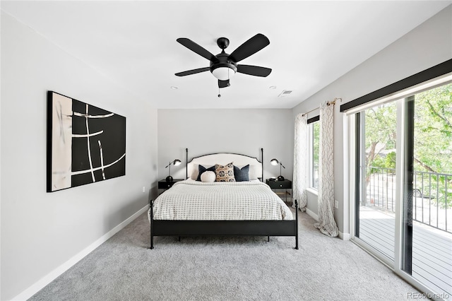 carpeted bedroom featuring access to exterior, visible vents, ceiling fan, and baseboards