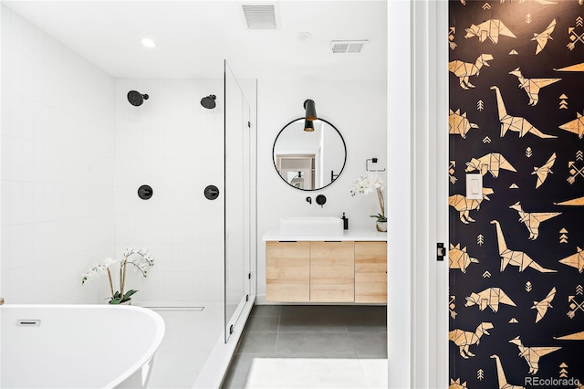 full bath with tile patterned floors, visible vents, tiled shower, and a soaking tub