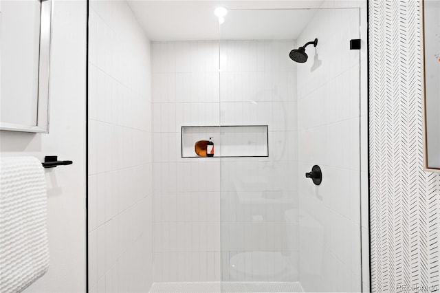 full bath featuring a tile shower