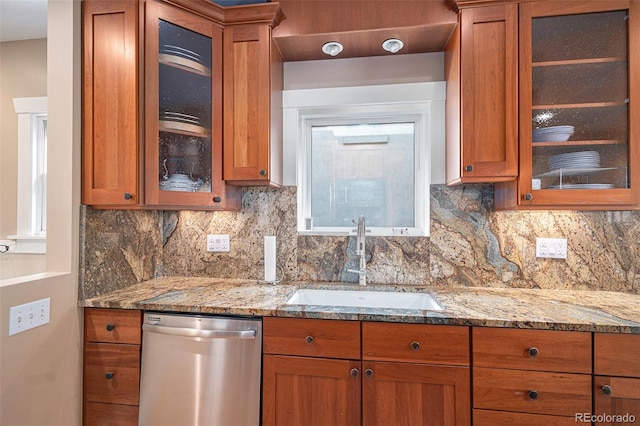 726 S Corona St, Denver, CO 80209 - kitchen with dishwasher, a sink, brown cabinetry, glass insert cabinets, and light stone counters