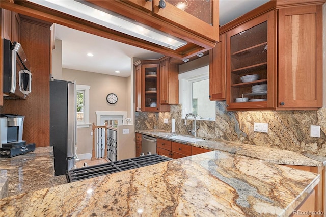 726 S Corona St, Denver, CO 80209 - kitchen with a sink, stainless steel appliances, brown cabinets, decorative backsplash, and recessed lighting