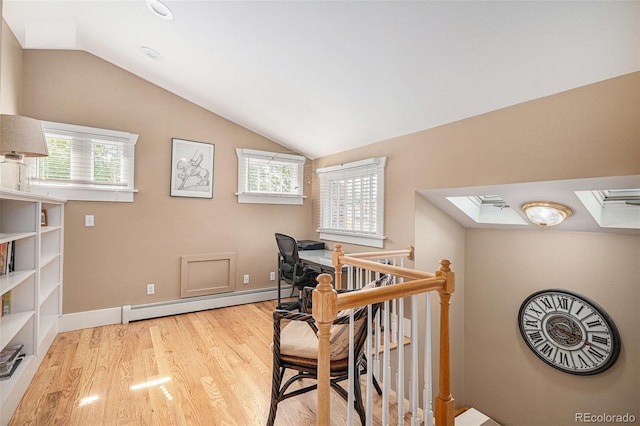 726 S Corona St, Denver, CO 80209 - office area featuring a skylight, a baseboard radiator, wood finished floors, vaulted ceiling, and baseboards