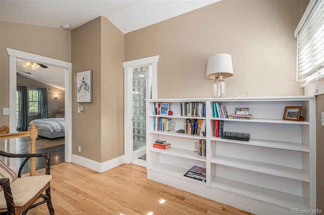 726 S Corona St, Denver, CO 80209 - living area with lofted ceiling, ceiling fan, wood finished floors, and baseboards