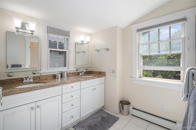 726 S Corona St, Denver, CO 80209 - bathroom featuring a baseboard heating unit, plenty of natural light, vaulted ceiling, tile patterned flooring, and double vanity