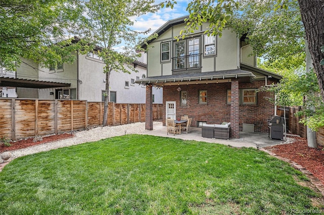 726 S Corona St, Denver, CO 80209 - back of property featuring a balcony, a patio area, brick siding, an outdoor living space, and stucco siding