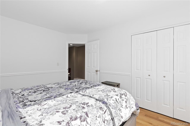 bedroom with a closet and light wood-type flooring