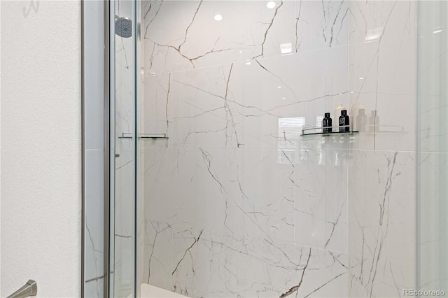 full bathroom featuring a marble finish shower