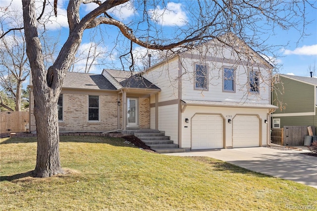 tri-level home featuring driveway, fence, a front yard, an attached garage, and brick siding