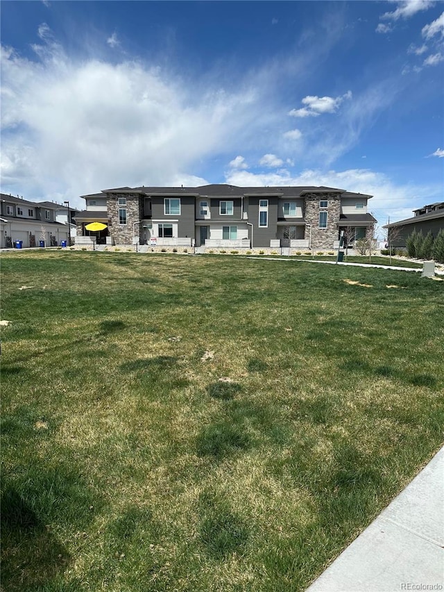 16433 Askins Loop, Parker, CO 80134 - view of front of property featuring a front yard and stone siding