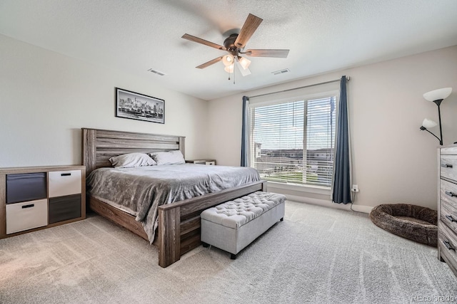 16433 Askins Loop, Parker, CO 80134 - bedroom featuring light colored carpet, ceiling fan, and a textured ceiling
