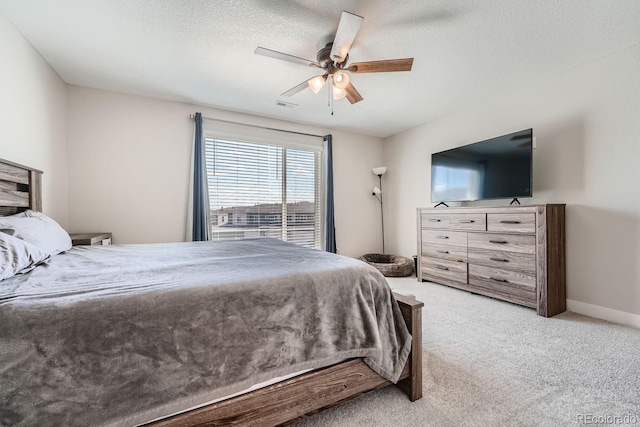 16433 Askins Loop, Parker, CO 80134 - bedroom featuring light carpet, ceiling fan, baseboards, and a textured ceiling