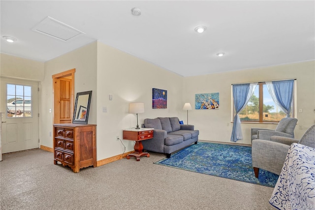 carpeted living room with baseboards, attic access, and recessed lighting