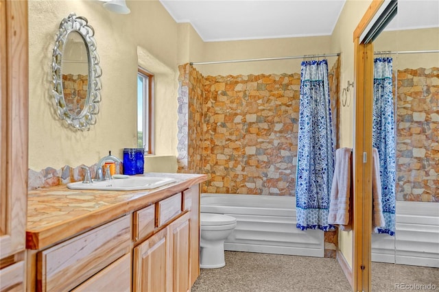 bathroom with vanity, toilet, crown molding, and shower / tub combo