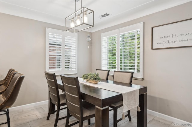 2664 Forest St, Denver, CO 80207 - dining room with baseboards and light tile patterned floors